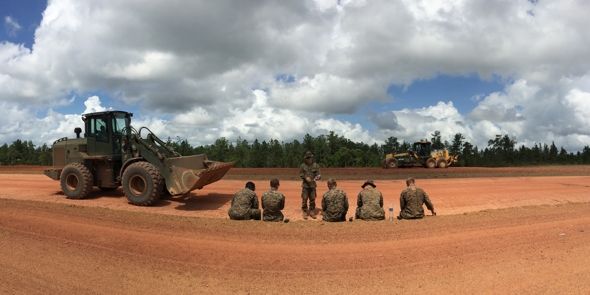 group of men near tractor